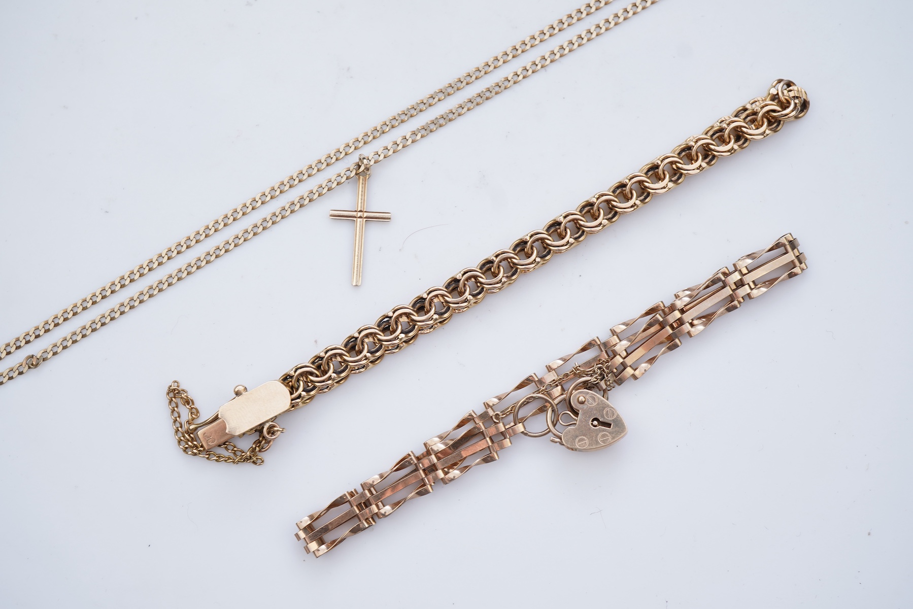 Two gold bracelets and a gold necklace
